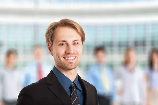 Businessman in front of his team — Stock Photo, Image