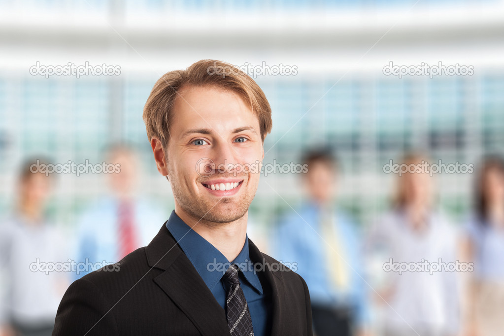 Businessman in front of his team
