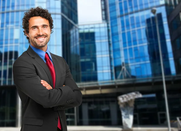 Handsome businessman in city — Stock Photo, Image
