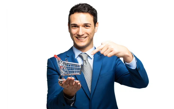 Smiling Businessman Holding Mini Shopping Cart — Stock Photo, Image