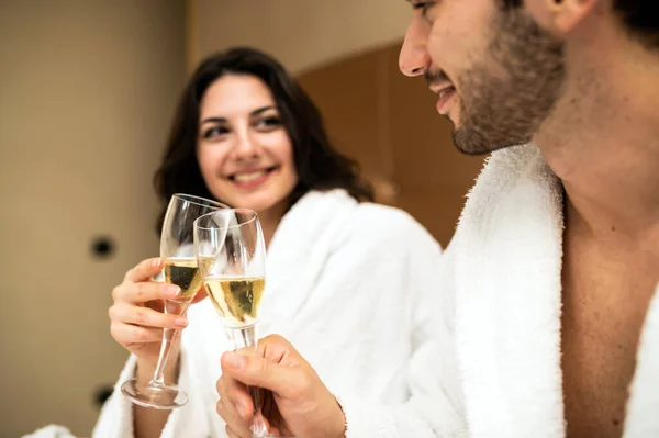 Cheerful Couple Bathrobe Toasting Champagne Glasses — Stock Photo, Image