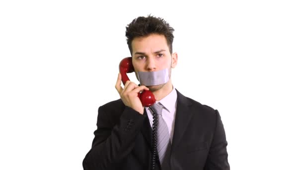 Бизнесмен Говорить Телефону Потому Рот Клейкой Лентой — стоковое видео