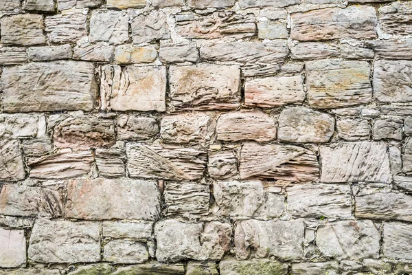 Medieval wall made ​​of large old stones — Stock Photo, Image