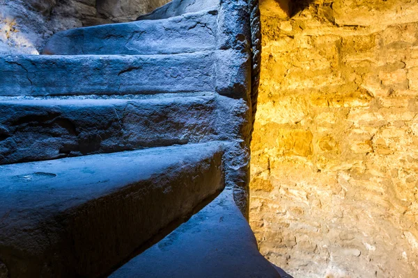 Warm and cold light in stone staircase — Stock Photo, Image