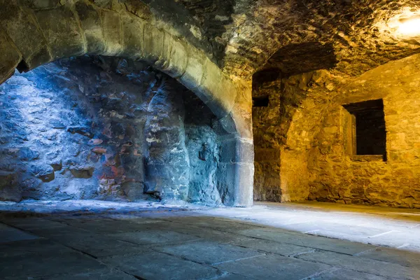 Warm and cold light in stone chamber — Stock Photo, Image