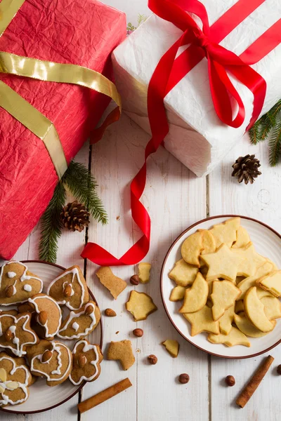 Christmas view on the table full of gifts and cookies — Stock Photo, Image