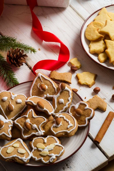 Homemade gingerbread Cookies within Christmas decorations — Stock Photo, Image