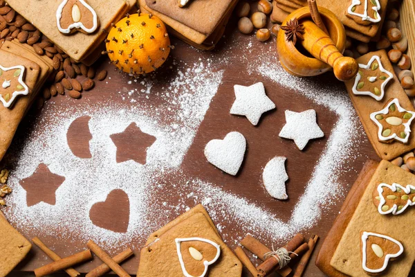 Christmas gingerbread frame surrounded by nuts — Stock Photo, Image