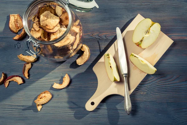 Raw and dried apple in jar — Stock Photo, Image