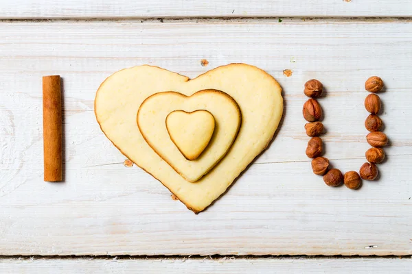 "Te amo "frase arreglada con galletas y nueces no. 1. —  Fotos de Stock