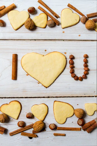 "Te amo "frase arreglada con galletas y nueces no. 10 —  Fotos de Stock