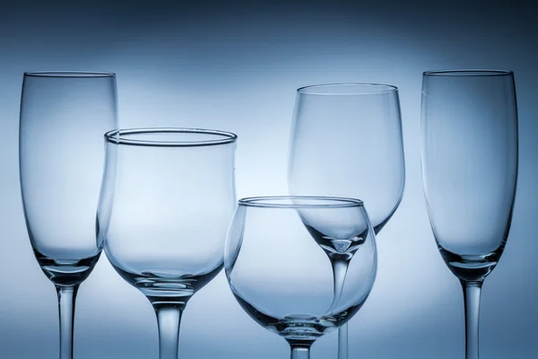 Closeup of empty glasses on a blue background — Stock Photo, Image