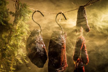 Hanging ham in the smokehouse clipart