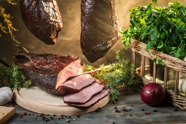 Freshly smoked ham in smokehouse — Stock Photo, Image