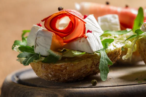 Closeup of fresh sandwiches made of parma ham and brie cheese — Stock Photo, Image