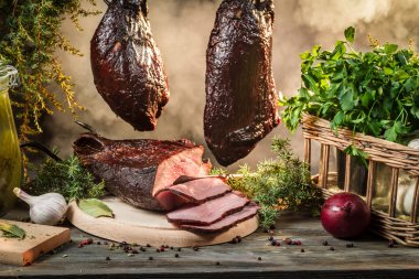 Freshly smoked ham in homemade smokehouse clipart