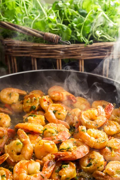 Hot shrimp fried in a pan with fresh herbs — Stock Photo, Image
