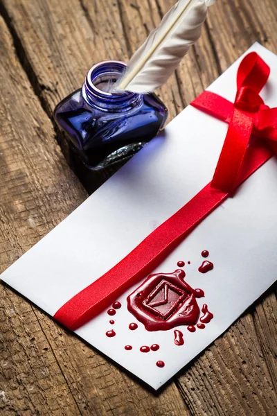 Ancient scrolls and old envelope with blue inkwell — Stock Photo, Image