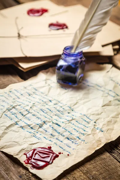 Ancient scrolls and old envelope with blue inkwell — Stock Photo, Image