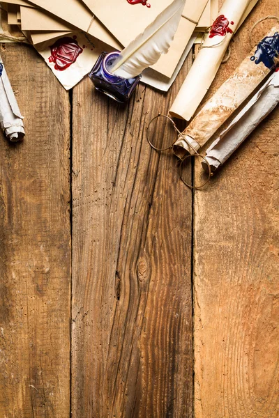 Ancient scrolls and old envelope with blue inkwell — Stock Photo, Image