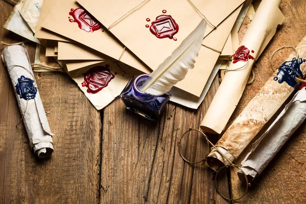 Ancient scrolls and old envelope with blue inkwell — Stock Photo, Image