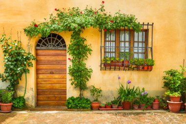 Beautiful porch decorated with flowers in italy clipart