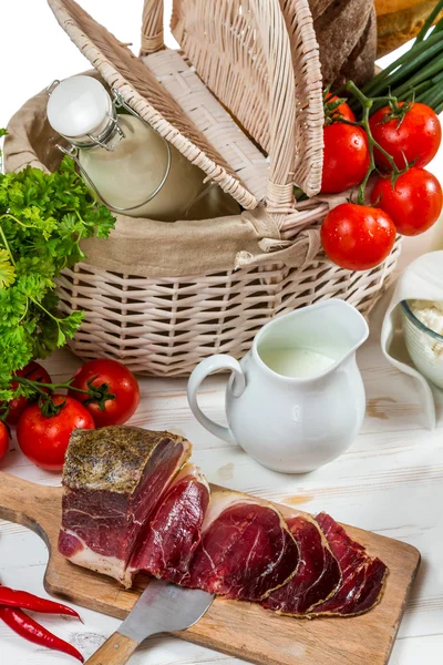 Basket full of fresh vegetables and ham — Stock Photo, Image