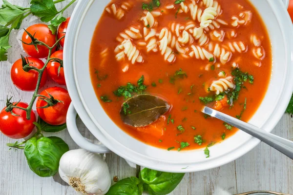 Freshly sliced tomatoes and tomato soup — Stock Photo, Image