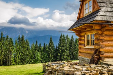 Rural cottage in the mountains clipart
