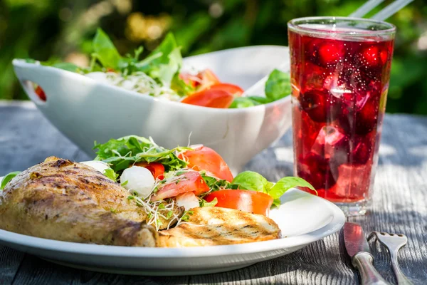 Freshly served dinner in the garden — Stock Photo, Image