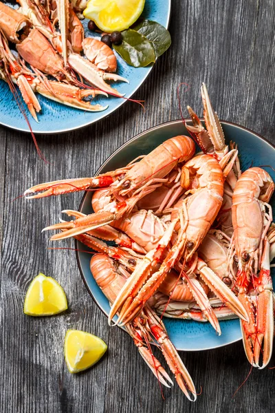 Lobster with lemon as a seafood dish — Stock Photo, Image