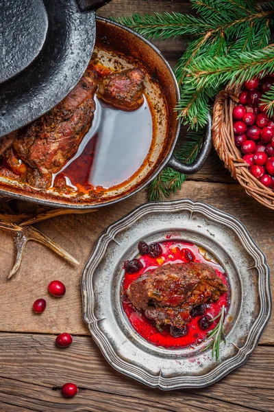 Roast venison with cranberry sauce and served in the forester lo — Stock Photo, Image