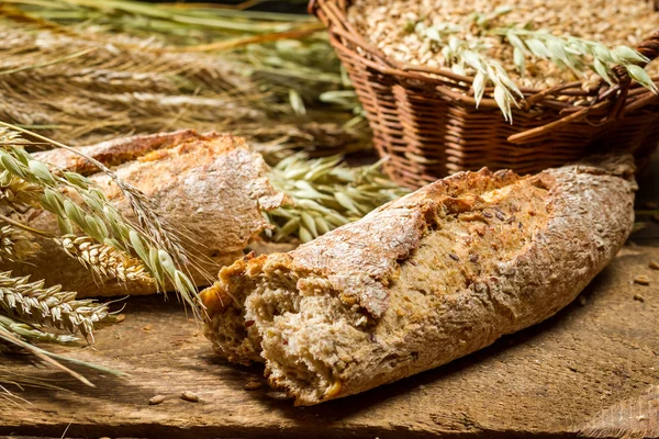 Closeup of freshly baked baguette broken in half — Stock Photo, Image