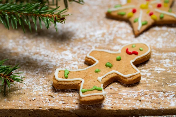 Gingerbread Man under a sprig of spruce — Stock Photo, Image