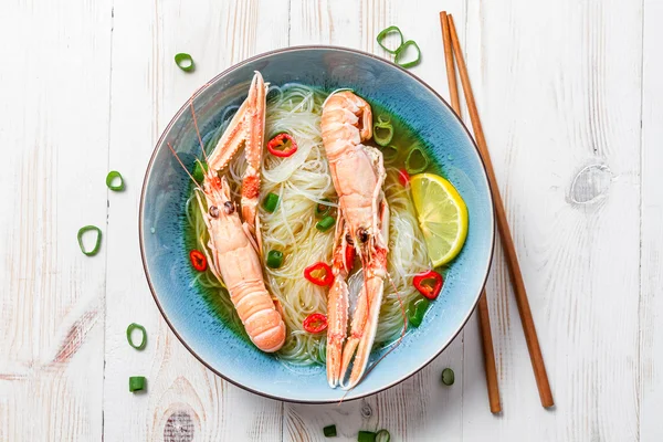 Closeup of traditional Thai soup with scampi — Stock Photo, Image