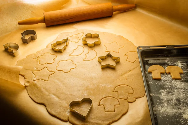 Cutting of different shapes of gingerbread cookies — Stock Photo, Image