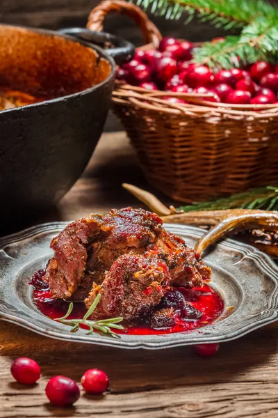 Venison with cranberry sauce and rosemary — Stock Photo, Image