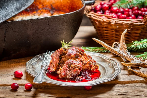 Freshly served venison with cranberries and rosemary — Stock Photo, Image