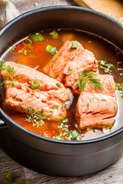 Fish soup spiced with dill and chilli pepper clipart