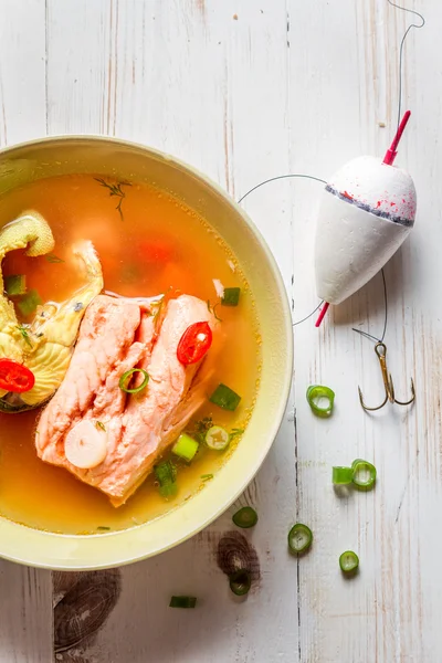 Closeup of salmon soup with chive — Stock Photo, Image