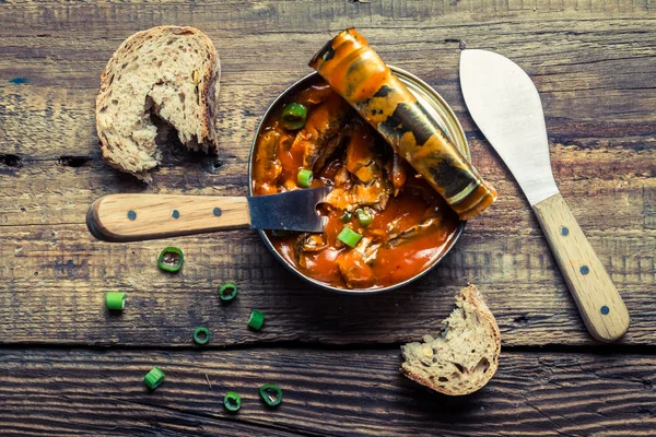 Can the fish in tomato sauce with chives — Stock Image Can the fish in tomato sauce with chives Royalty Free Stock Images