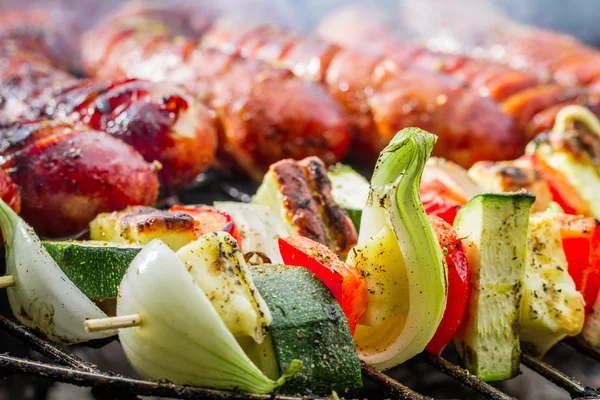 Closeup of hot skewers on the grate — Stock Photo, Image