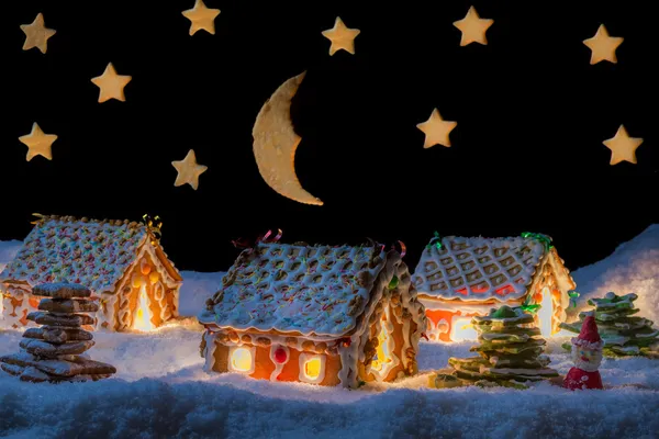 Gingerbread lodge with light from the window in winter — Stock Photo, Image