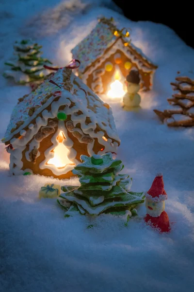 Small gingerbread houses in the snow — Stock Photo, Image