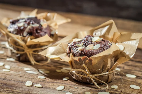 Closeup of chocolate muffins with almonds — Stock Photo, Image