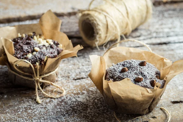 Closeup of decorating chocolate muffins — Stock Photo, Image