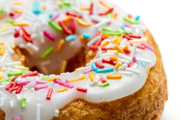 Fresh donut decorated with colored sprinkles — Stock Photo, Image