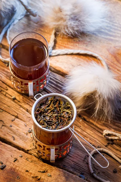 Warming tea served in old-fashioned — Stock Photo, Image