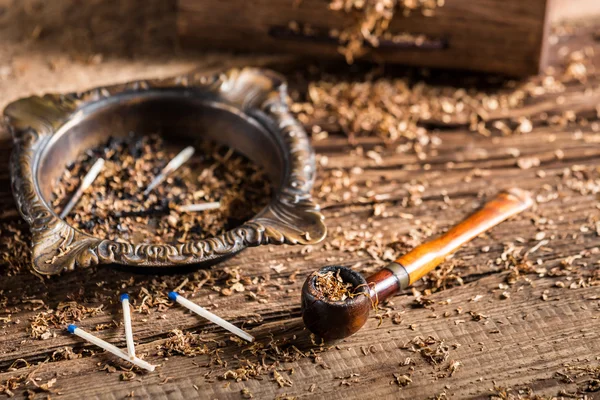 Old pipe tobacco with ashtray — Stock Photo, Image