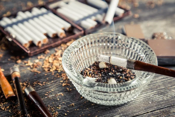 Smoke rising from a pipe in the ashtray — Stock Photo, Image